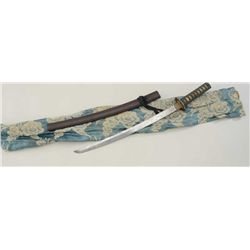 Japanese Wakasashi or medium size sword in  fancy traditional Samuri style mountings.   Our consigno
