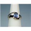 Image 2 : Stylish 14 karat yellow gold freeform custom  made ring set with an oval Tanzanite weighing  over 1.