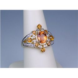 Splendid 14 karat yellow gold ladies ring set  with and orange sapphire weighing 1.85  carats with s