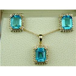 Dazzling 14 karat yellow gold ladies  pendant/earring ensemble set with three  matching Swiss blue t