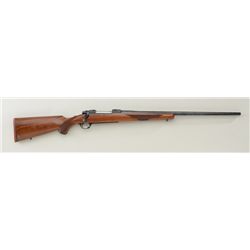 Ruger Model 77 bolt-action rifle, .338 Win.  Mag. cal., 24-1/2” round barrel, blue finish,  checkere