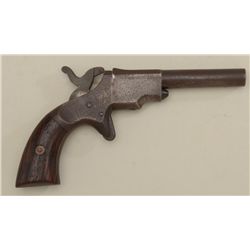 Unmarked spur trigger single shot pistol  showing dark patina over scattered pitting,  dark bore, ac