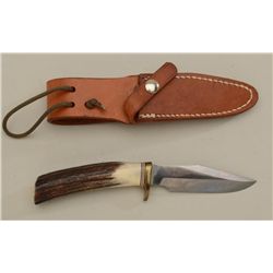 Randall knife with leather sheath (Orlando,  FLA) in fine condition; knife is approx.  8-1/2” overal