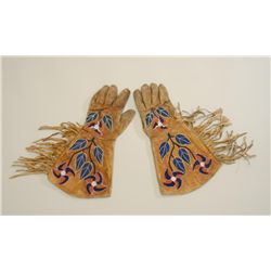 Large pair of beaded and fringed gauntlets in  overall good condition with trade cloth  interior lin