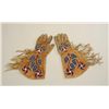 Image 1 : Large pair of beaded and fringed gauntlets in  overall good condition with trade cloth  interior lin