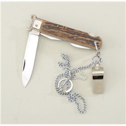 Shotgun extractor pocket knife with chain &  whistle in overall good condition.  Est.:   $50-$100.