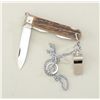 Image 1 : Shotgun extractor pocket knife with chain &  whistle in overall good condition.  Est.:   $50-$100.