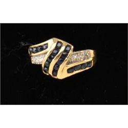 Ladies ring in 14k yellow gold set with  square sapphires and diamonds. Est. $400-$500