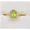 Image 1 : One 14k yellow ring set with oval peridot  weighing approx. 2ct and surrounded by  diamonds. Est. $5