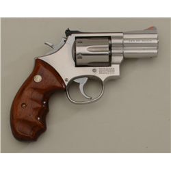 Smith & Wesson Model 686 DA revolver, .357  Magnum cal., 2-1/2” barrel, stainless steel,  finger gro