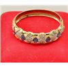 Image 1 : One 14k yellow gold hinged bangle bracelet  set with 5 oval cut sapphire weighing approx.  10ct and 