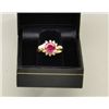 Image 1 : One 14k yellow gold ladies ring set with a  round ruby weighing 2.25ct surrounded by 12  diamonds (r