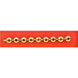 One 18k modern design bracelet set with  different colored gemstone. Gold weight 49  grams. Est. $4,