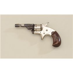 Colt 1872 Open Top revolver, .22 cal., 2-1/2”  barrel, nickel finish, wood grips, #111665.  This gun