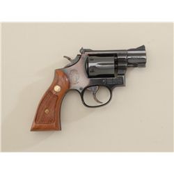 Smith & Wesson Model 15-4 DA revolver, .38  Special cal., 2” barrel, blue finish,  checkered wood me