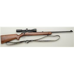 Winchester Model 75 bolt-action target rifle,  .22LR cal., 28” round barrel, wood stock  with camo n