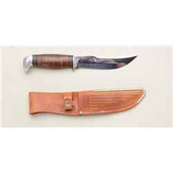 Case XX belt knife in Case XX leather sheath  approx. approx. 9” overall with an approx. 5”  blade, 