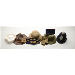 Great lot of eleven misc. pieces of head gear  including a French policeman’s black and red  cap wit