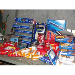 Shelf lot of assorted candies, canned goods,