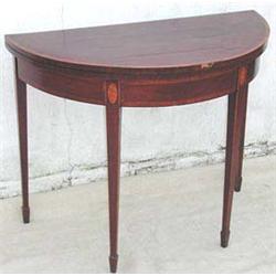 A GEORGE III MAHOGANY DEMI LUNE CARD TABLE...