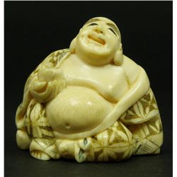 JAPANESE IVORY NETSUKE FIGURE OF BUDDHA SIGNED