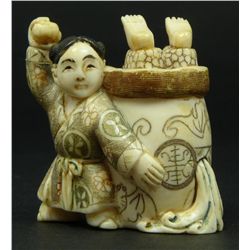JAPANESE CARVED IVORY NETSUKE OF BOYS SIGNED