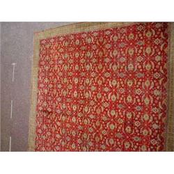 An Agra carpet the deep red ground with an al