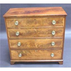 GEORGE III FIGURED MAHOGANY CHEST of four gra