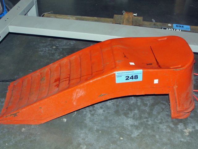 Pair of orange metal car ramps