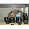 Image 1 : Lot of 4 35mm SLR camera lenses with storage