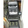 Image 1 : Black leather recliner with footstool