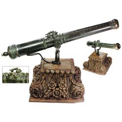 Bronze signal cannon with "sea dog" lifting handles, probably British, 1600s, with ornate mahogany s