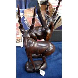 A pair of hard wood antelope figures....