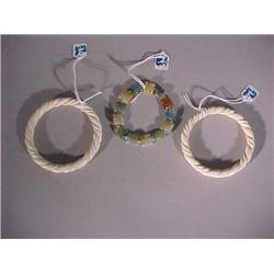 Three Chinese bracelets: pair of carved ivory