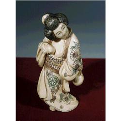 Well-carved and slightly polychromed, ivory n