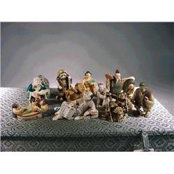 Box of twelve, carved, stained and some polyc