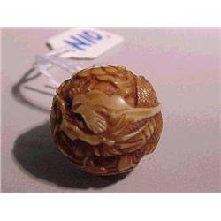 Finely carved and stained, antique ivory ojim