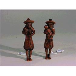 Two well-carved, tall wood netsuke of standin