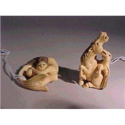 Two very well-carved and detailed, ivory nets