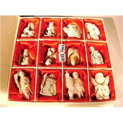 Box of twelve, carved ivory netsuke, eleven f