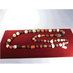 Fine necklace of numerous old and antique oji