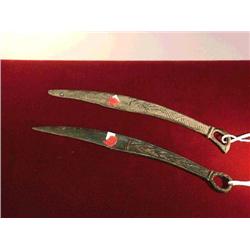 Two ancient, Ordos Culture bronze daggers: on