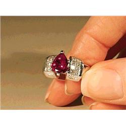 Heavy, ladies platinum ring, centering a pear