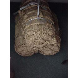 Group of three old, Japanese bales of straw