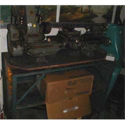 A Myford metal lathe with cabinet and tool...