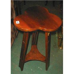 A mahogany Arts and Crafts clover leaf sha...