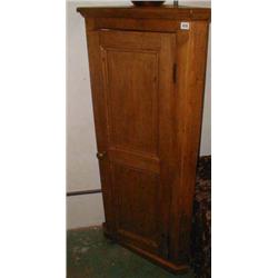 A pine floor standing corner cupboard with...