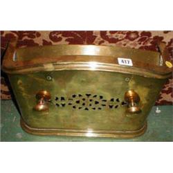 A small C19th brass fender with pierced de...