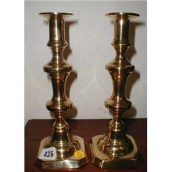 A pair of C19th brass candlesticks...