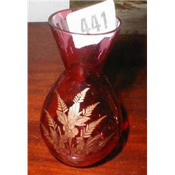A cranberry vase with gilt etched decorati...